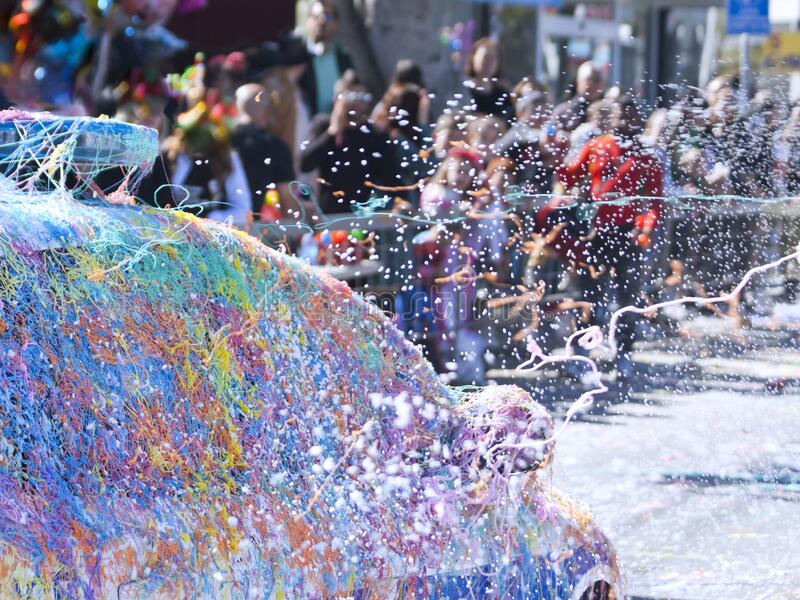 street-carnival-silly-strings-artificial-snow-blurred-view-city-street-car-sprayed-colorful-si...jpg